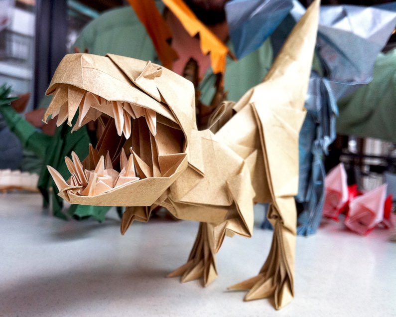 A dinosaur made out of origami